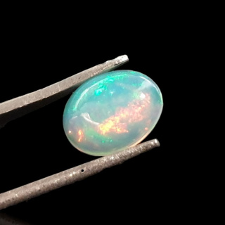 Opal z Etiopii kaboszon 9x7 mm nr 723