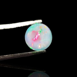 Opal z Etiopii kaboszon fi 7 mm nr 794