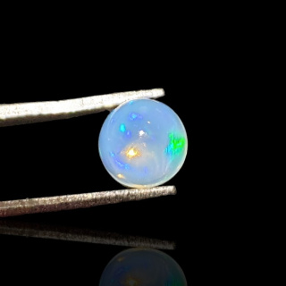 Opal z Etiopii kaboszon fi 7 mm nr 809