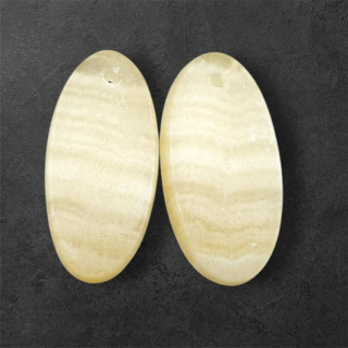 Żółty aragonit para kaboszonów z dziurką 24x12 mm nr P947