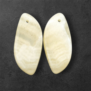 Żółty aragonit para kaboszonów z dziurką 25x11 mm nr P948