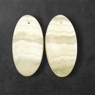 Żółty aragonit para kaboszonów z dziurką 27x14 mm nr P945