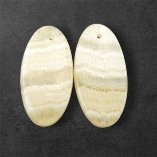Żółty aragonit para kaboszonów z dziurką 28x14 mm nr P955