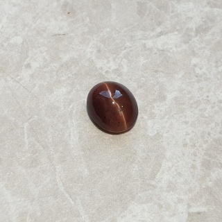 Skapolit kocie oko kaboszon 11x10 mm nr 144