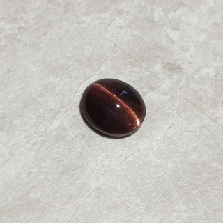 Skapolit kocie oko kaboszon 12x10 mm nr 192