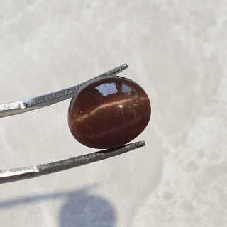 Skapolit kocie oko kaboszon 12x10 mm nr 98