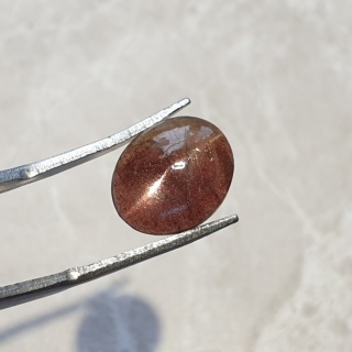 Skapolit kocie oko kaboszon 12x10 mm nr 99