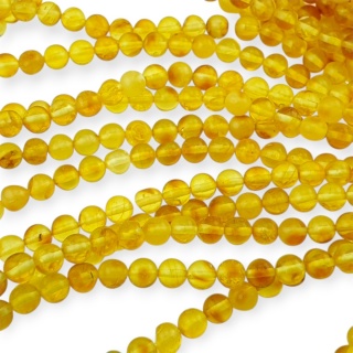 Bursztyn bałtycki koralik nieregularny około 5,7 mm sznur 19 cm