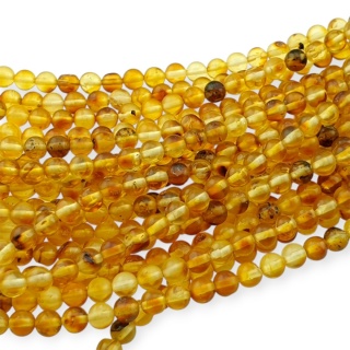 Bursztyn bałtycki koralik nieregularny około 5 mm sznur 19 cm