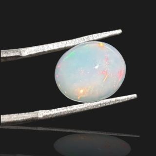 Opal z Etiopii kaboszon 12x10 mm nr 922