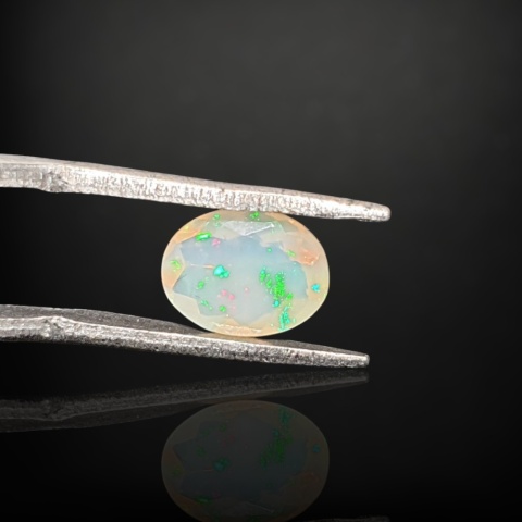 Ethiopian faceted opal 9x7 mm no A174