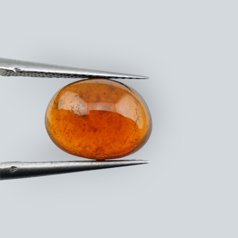 Hessonite garnet cabochon 11x8 mm no 125