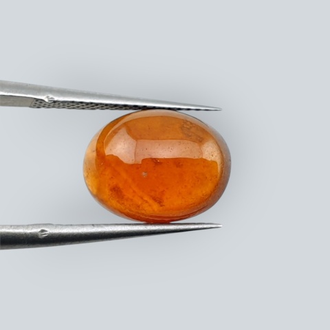 Hessonite garnet cabochon 11x9 mm no 152