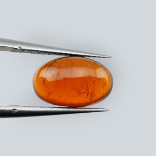 Granat Hessonit kaboszon 12x7 mm nr 201