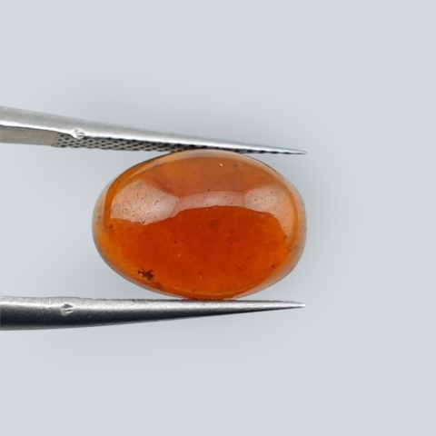 Hessonite garnet cabochon 12x9 mm no 83