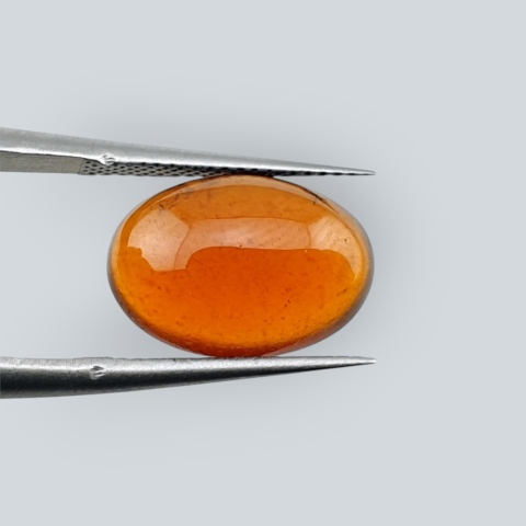 Hessonite garnet cabochon 13x9 mm no 147