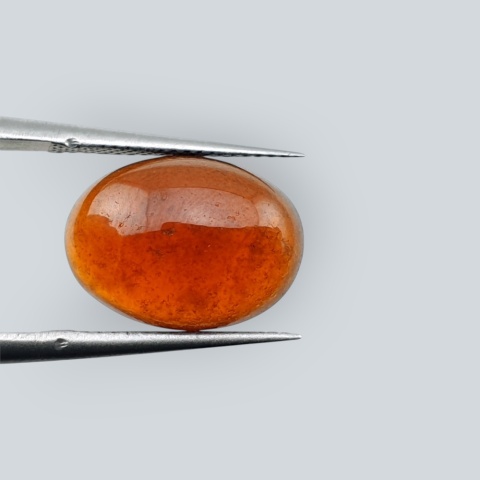 Hessonite garnet cabochon 14x10 mm no 142