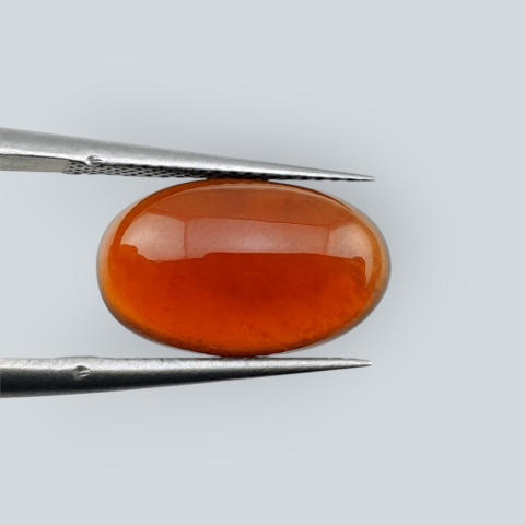 Hessonite garnet cabochon 14x8 mm no 180