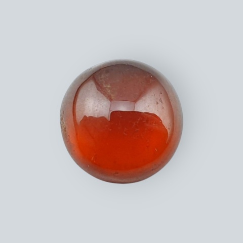 Hessonite garnet cabochon fi 11 mm no 63