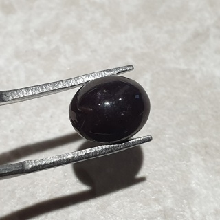 Granat gwiaździsty kaboszon 10x8 mm nr 304