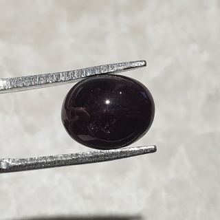 Granat gwiaździsty kaboszon 10x8 mm nr 324