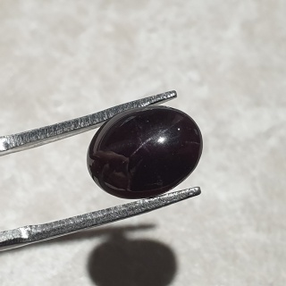 Granat gwiaździsty kaboszon 11x8 mm nr 292