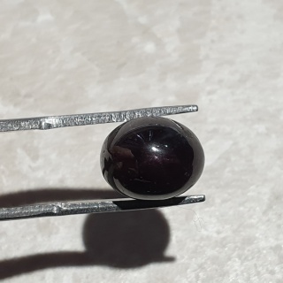 Granat gwiaździsty kaboszon 11x9 mm nr 145