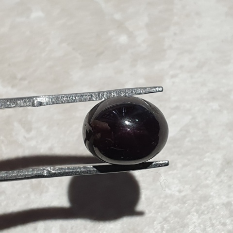 Granat gwiaździsty kaboszon 11x9 mm nr 145