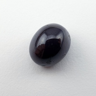 Granat gwiaździsty kaboszon 11x9 mm nr 145