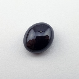 Granat gwiaździsty kaboszon 11x9 mm nr 192