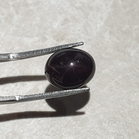 Granat gwiaździsty kaboszon 11x9 mm nr 275