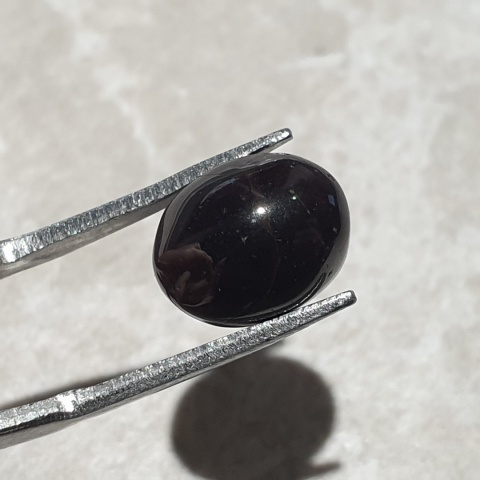 Granat gwiaździsty kaboszon 11x9 mm nr 291