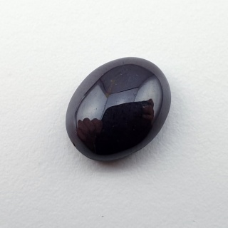 Granat gwiaździsty kaboszon 11x9 mm nr 311