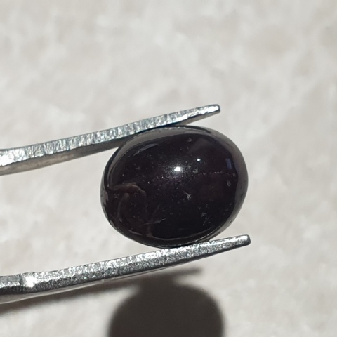 Granat gwiaździsty kaboszon 11x9 mm nr 321