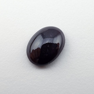 Granat gwiaździsty kaboszon 11x9 mm nr 332