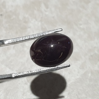 Granat gwiaździsty kaboszon 12x10 mm nr 313