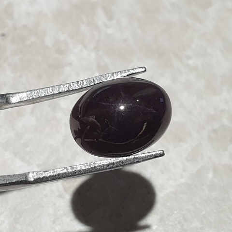 Granat gwiaździsty kaboszon 12x10 mm nr 313