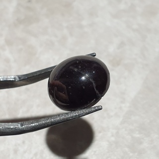 Granat gwiaździsty kaboszon 12x11 mm nr 219