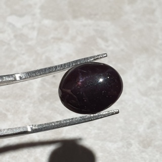 Granat gwiaździsty kaboszon 12x9 mm nr 214