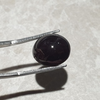 Granat gwiaździsty kaboszon 13x11 mm nr 243