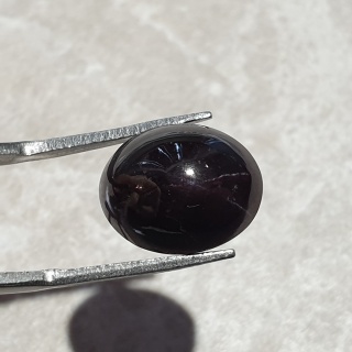 Granat gwiaździsty kaboszon 14x11 mm nr 158