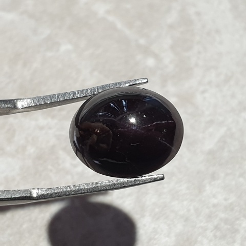 Granat gwiaździsty kaboszon 14x11 mm nr 158