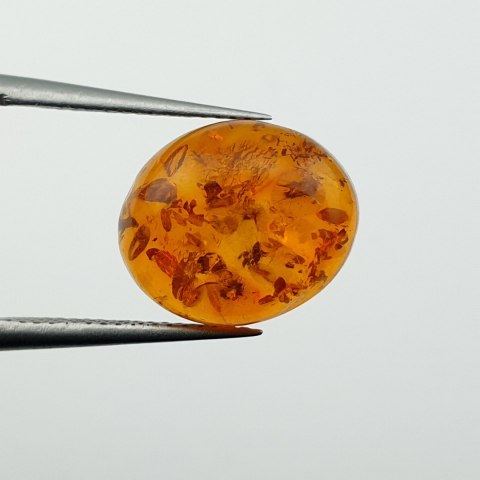 Bursztyn bałtycki kaboszon 12x10 mm nr A983