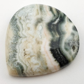 Saturn chalcedon kaboszon 38x34 mm nr 22