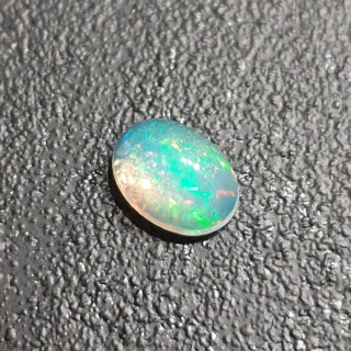 Opal z Etiopii kaboszon 9x7 mm nr 356