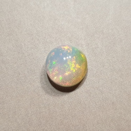 Opal z Etiopii kaboszon fi 7 mm nr 412