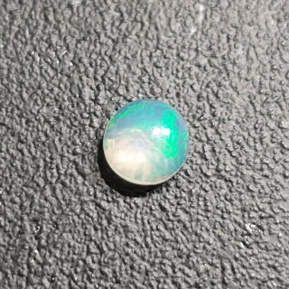 Opal z Etiopii kaboszon fi 7 mm nr 416