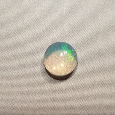 Opal z Etiopii kaboszon fi 7 mm nr 416