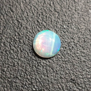 Opal z Etiopii kaboszon fi 7 mm nr 420