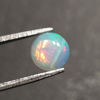 Opal z Etiopii kaboszon fi 7 mm nr 420